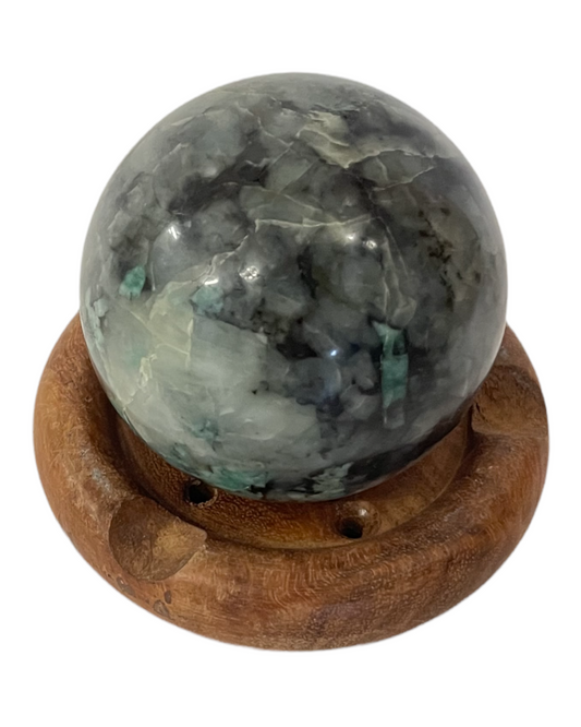 Emerald - sphere on a wooden plinth