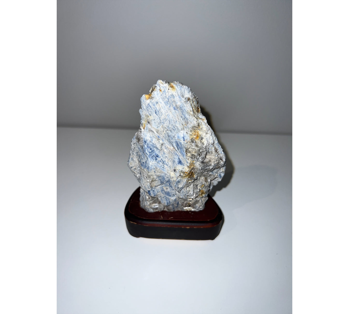Kyanite - on a wooden plinth